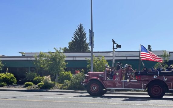 Q. How many generations have ridden on the firetruck at the end of the school year?
A. A bunch …On Monday, June 9, this group took a spin through town on the 1939 Holabird firetruck.