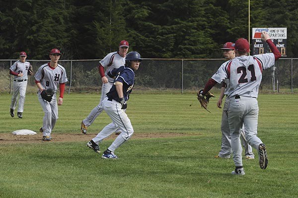 Forks base runner Javier Contreras was caught in a pick off play by a surrounding group of Grizzles Thursday in Beaver.  Hoquiam defeated Forks 3 to 0 and 8 to 0 in the double header.