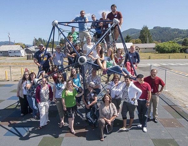 Quillayute Valley School District new teachers and their teacher mentors pose for a moment of fun on the new Forks Intermediate School playground equipment