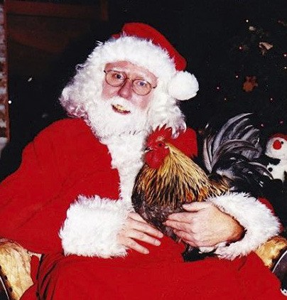 Peep the rooster hanging out with Santa.