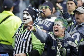 To inspire you — Seattle Seahawks fans yell in the first half of the game against the Arizona Cardinals on Nov. 23 in Seattle.