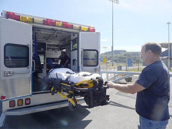 EMS crews demonstrate one of Forks Community Hospital's ambulances.