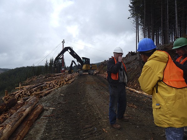 Logging tour guide Joe Seymour explains logging to people from all over the world.