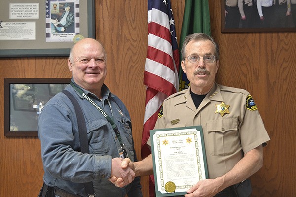 Jim Buck recently received an award from Sheriff Bill Benedict for his work on disaster preparedness.
