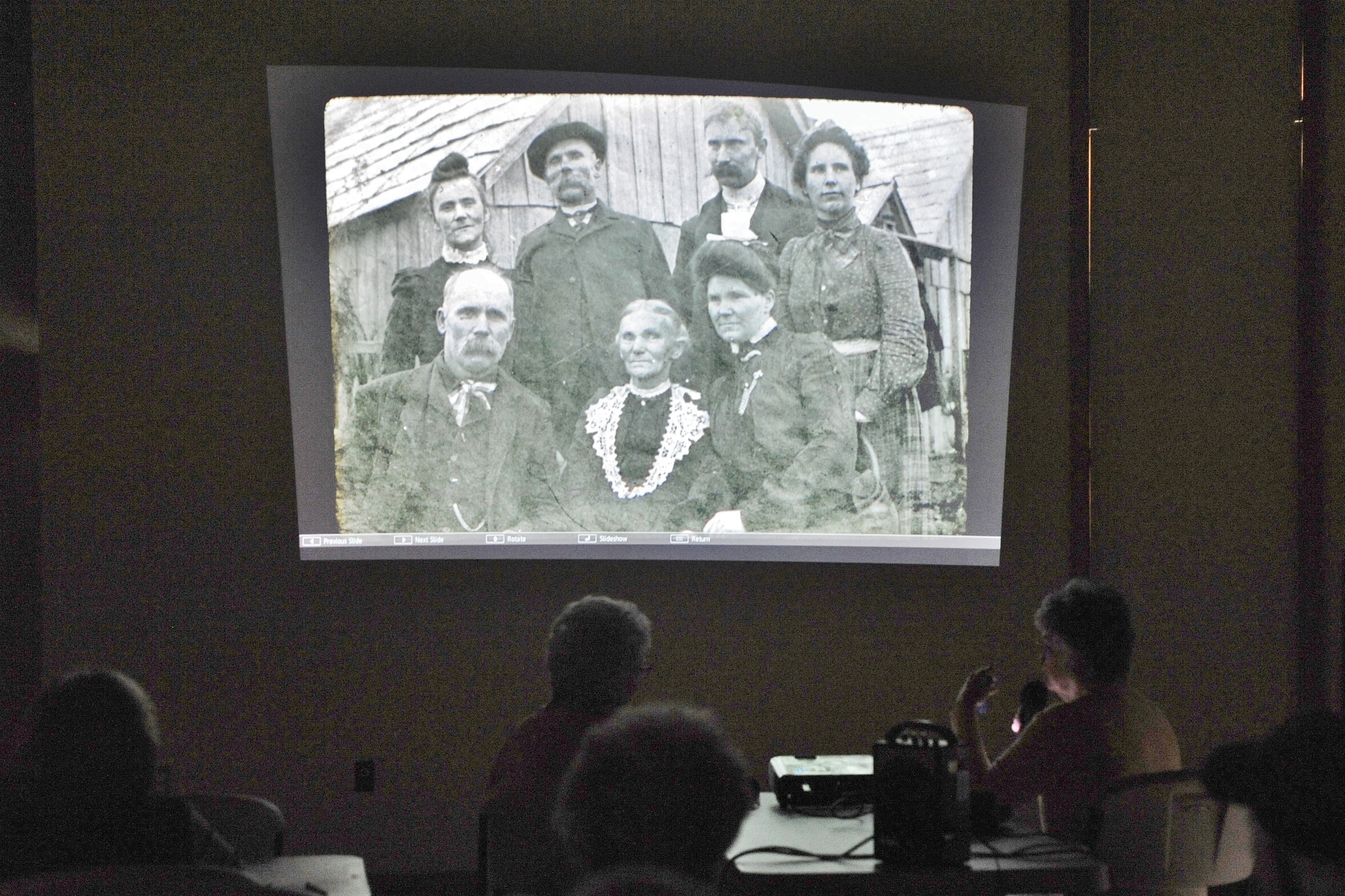 West End Historical Society member Adria Fuhrman shows slides of early days photos during the November historical society’s meeting held at the RAC. The group intends to show more of the West End photos during the 2017 season. The group meets at noon the third Tuesday of each month at the Rainforest Arts Center. The public is invited. Photo by Lonnie Archibald