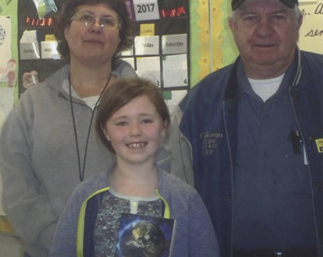 Cheryl Archibald of Forks Elementary School, poses with Chuck Jennings of the Forks Elks Lodge and one of the lucky dictionary recipients. Submitted Photo