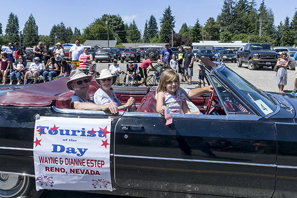 The 2017 Tourists of the Day were Wayne and Dianne Estep from Reno, Nevada. They rode in the parade in a 1965 Cadillac DeVille, owned and driven by Don James. They are visiting Olympic National Park and thought FORKS was the perfect spot to stay for several days. The Forks Chamber of Commerce appreciates them and all the tourists who visit our area. Photo David Youngberg