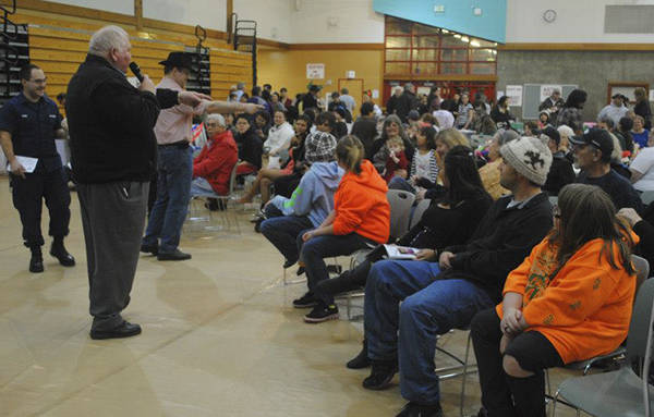 Bill Sperry presides over the live auction at the Cherish Our Children event December 2012. Photo Quileute Tribe