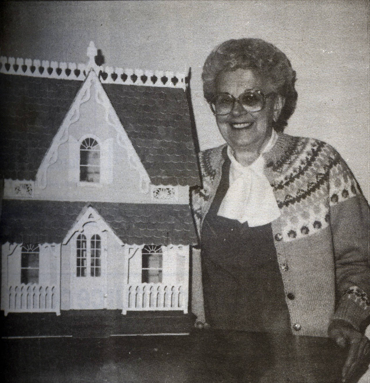 Vivian Rosmond is seen here with a dollhouse that she and her husband Robert created and donated to the 1990 QVSA. Forks Forum Archives