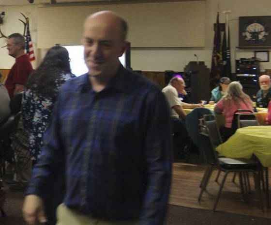 FHS grad and Elks Club member Dean McCoy is a blur but still smiling as he rushes to get more tables and chairs Saturday night at the Elks. Photo Christi Baron
