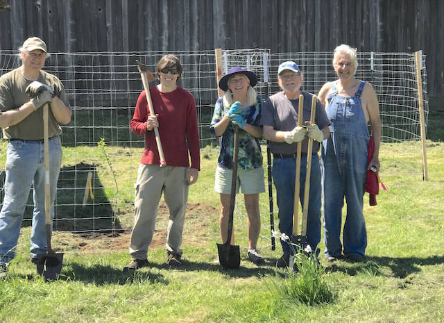 Larry Burtness, Matt Polinqua, Amy Cramer, Buddy Cloy and Roy Morris are happy at end of work day after planting five trees and building five elk fences. Photo Nancy Messmer