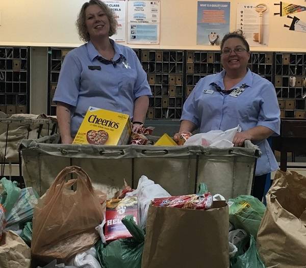 Tina Ray and Sherri Caldwell with donated food items. Submitted photo