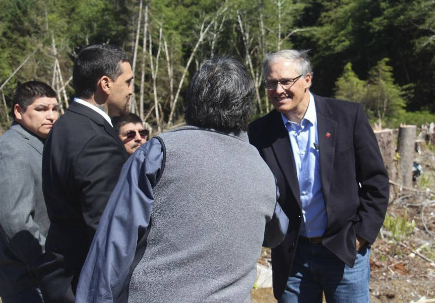 Before heading to La Push, Gov. Jay Inslee mets on the site of the future Quileute School with members of the Quileute Tribal Council. Tribal council members greeting the Governor are: Chairman Doug Woodruff, Vice Chairman Tony Foster, Secretary James Jackson, Treasurer Skyler Foster, and Member at Large Zachary Jones. The new school will be built on higher ground out of the tsunami danger zone. Plans for the school are moving along and if all goes well it could open for students in 2020 - 2021. Photo Christi Baron