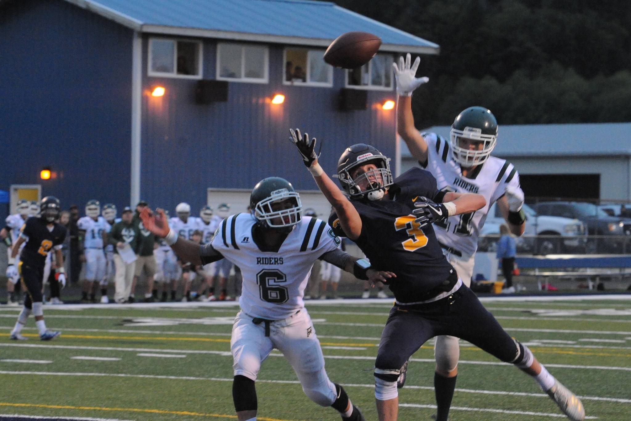 Spartan receiver Brett Moody eyes an overthrown pass in the end zone while Port Angeles defenders cover.