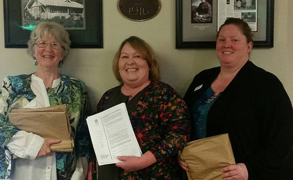 Soroptimist Foundation Awards Committee members Laura Farrell, Donna Blakeslee and Kelly McConnell holding award applications. Submitted Photo