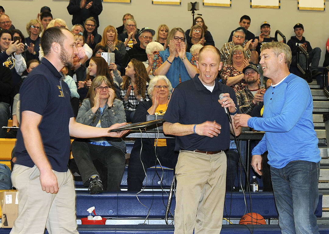 From left Spartan head girls basketball coach David Hurn and head boys coach Rick Gooding present former Spartan Ron Bagby with the award as he was inducted into the Spartan Basketball Hall of Fame. Photo by Lonnie Archibald