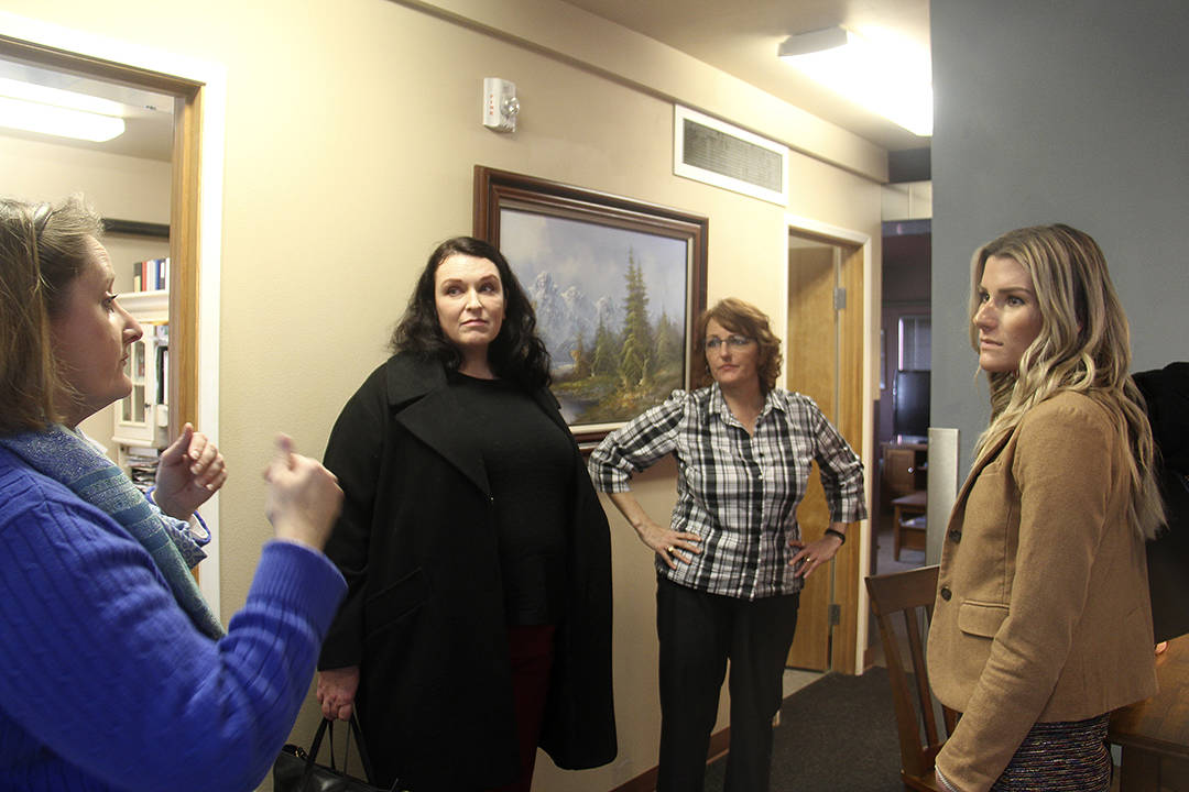 Jennifer Pelikan caseworker for Sarges Place speaks with several of Senator Patty Murrays staff members Chelsea Clayton, King County Director of Veterans Affairs, (In black) across from her is Colleen Bryan, Kitsap and Olympic Peninsula Director for Murray, as Cheri Tinker Executive Director of Sarges Place looks on.