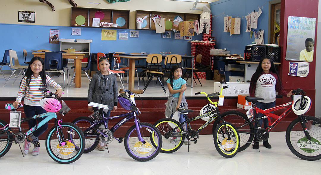 From left to right: Bike winners Mishel Martinez,Dema Martin-Mendoza, Elizabeth Ramirez-Jeronimo, Belinda Ramirez-Jeronimo. Photon Christi Baron