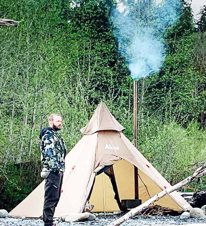 A photo from Morrison’s web page shows him next to one of his unique shelters.