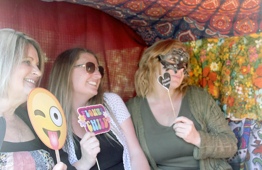 Some friends stopped by to demonstrate how the Shutterbug bus works! Christine Treichel, Laci Johnson, and Shannon Damron grabbed a few props and mugged it up for the camera. Photos Christi Baron