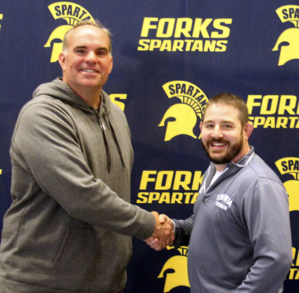 New Forks High School Football coach Trevor Highfield is welcomed to FHS by Spartan Athletic Director Kyle Weakley. Photo Christi Baron