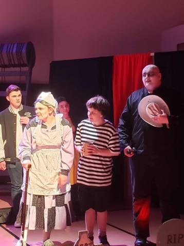 Some of the cast of <em>Addams Family the Musical,</em> Emma Grayce<em> </em>is front row left in the photos. Submitted photo