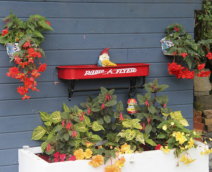 At Andersonville, Cheryl Anderson has created several gnome retreats and repurposed this little red wagon.