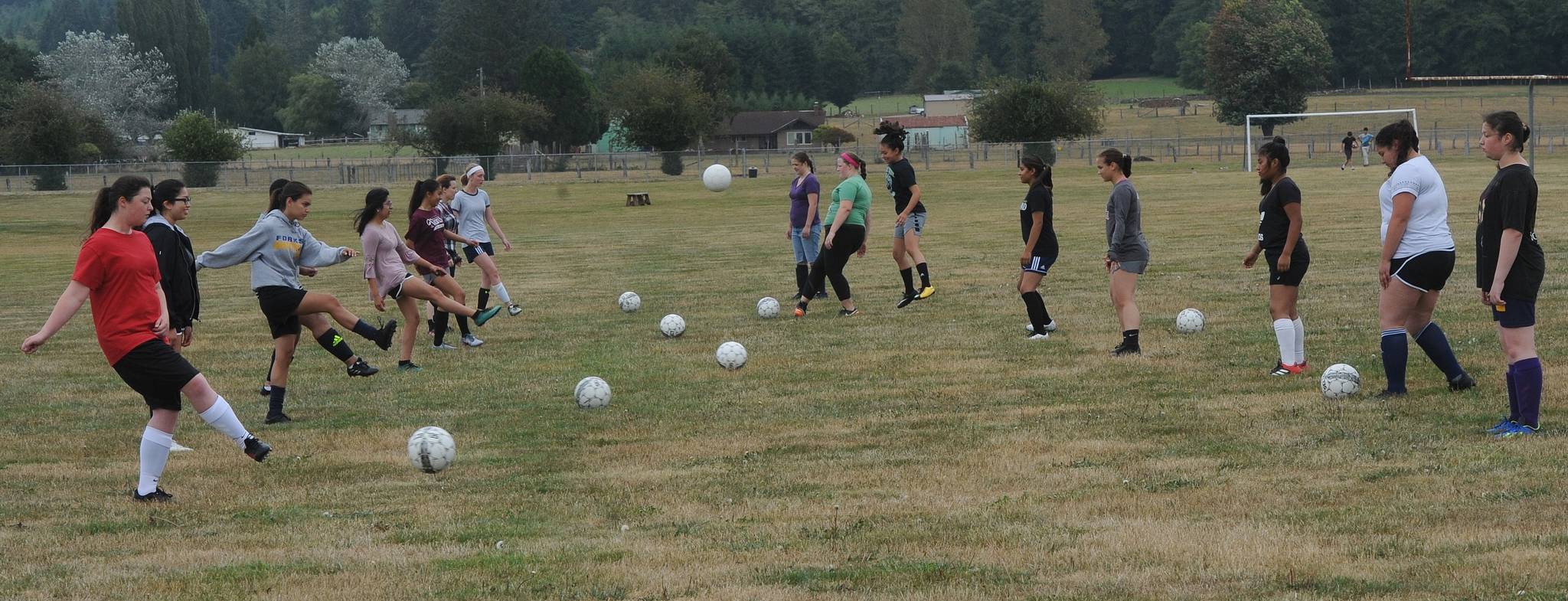 The girl’s soccer team practices on the Spartan practice field in preparation for the upcoming season. Photo by Lonnie Archibald