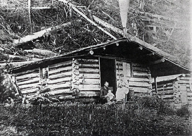The Hopkins family cabin was located at the foot of the hill now called Bigler. In this photo Mr. and Mrs. Hopkins with baby Cecile. Photos were taken by Elmer Hopkins George’s uncle.