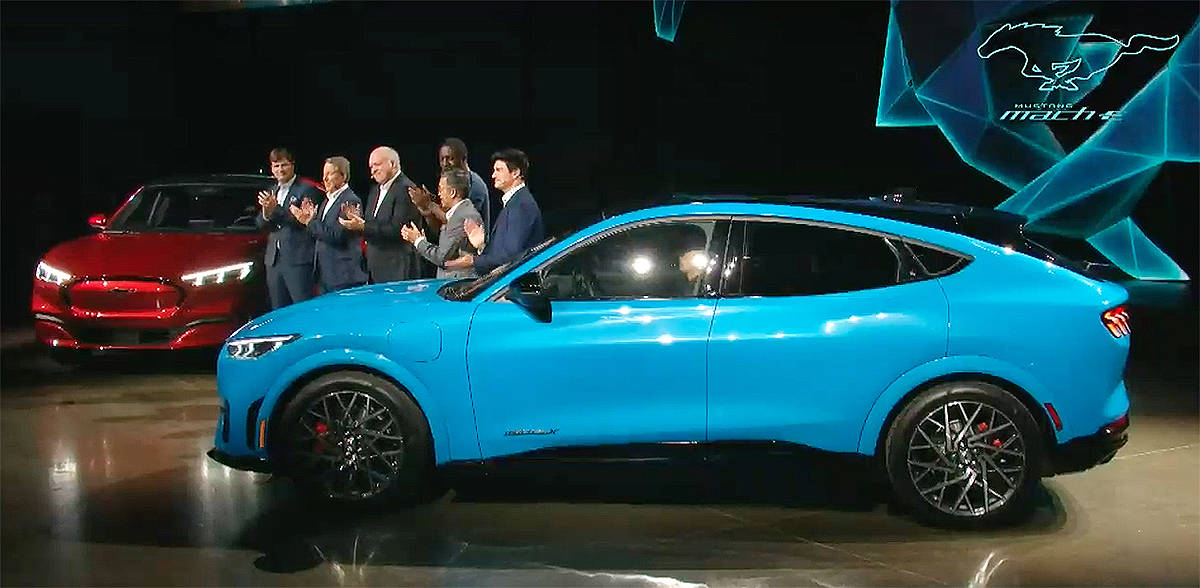Ford Motor Company executives and actor Idris Elba celebrate the unveiling of the Mustang Mach E in an online event Sunday. Ford Motor Company/YouTube