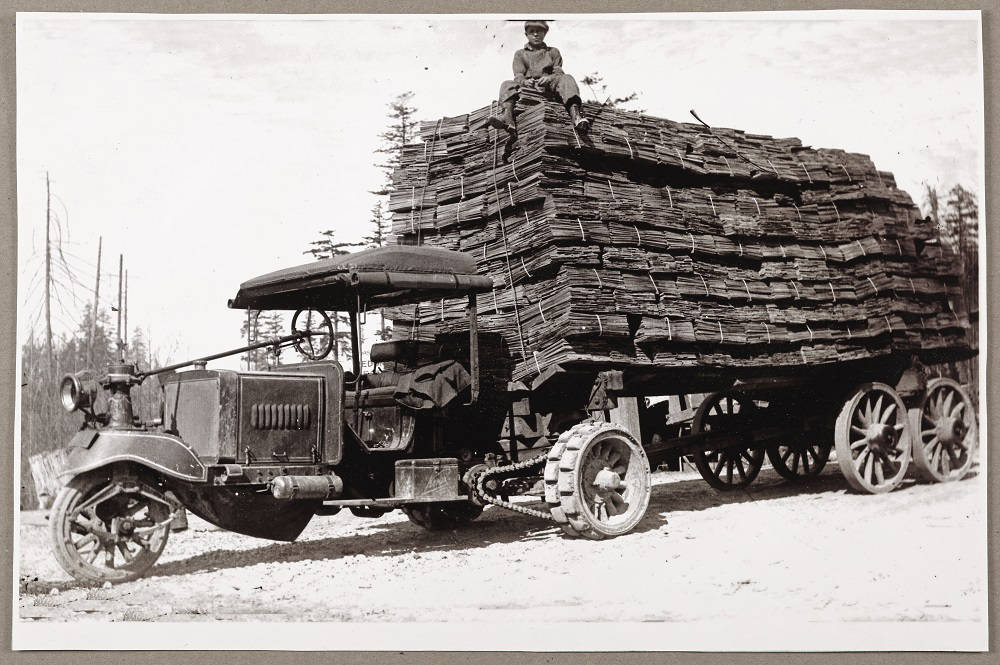 Three Wheel Truck Hauling Shingles.