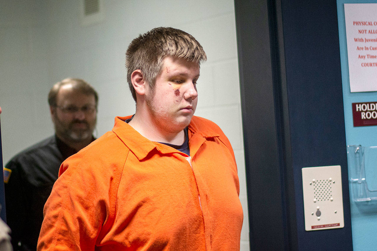 Phillip Z. Cowles, 17, is escorted into the courtroom at Clallam County Juvenile and Family Services on Wednesday, where he was charged with first-degree murder in the shooting death of 19-year-old Tristen Pisani. (Jesse Major/Peninsula Daily News)
