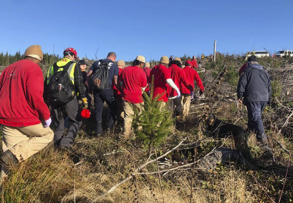 Emergency personnel secured the injured hiker on a gurney. Eight offenders proceeded to pack him up the hill with an additional saw-trained incarcerated crew member cutting a pathway to assist with footing. OCC Photo