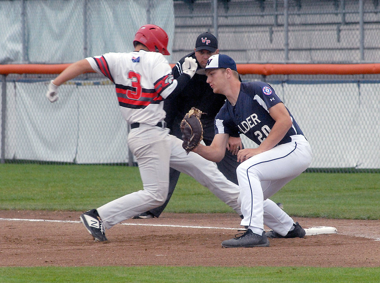 Wilder Baseball first baseman Lucas Jarnagin attempts to catch Australia White baserunner Geurdan Jackson-Murphy off the bag during the 2019 Firecracker Classic at Civic Field. (Keith Thorpe/Peninsula Daily News file)