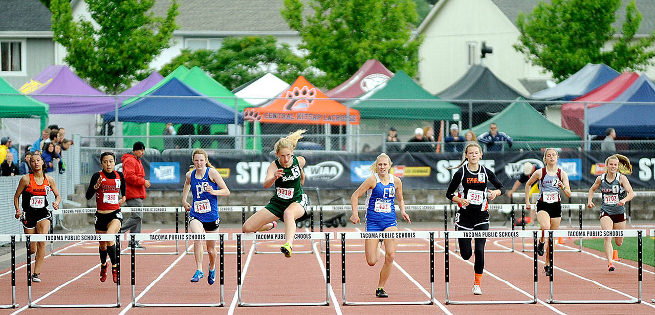 Port Angeles’ Millie Long, center, wins her heat in the 100-meter hurdles during the 2019 Class 2A State Track Championship. Long went on to win the state championship in the 300-meter hurdles. (Michael Dashiell/Olympic Peninsula News Group file)