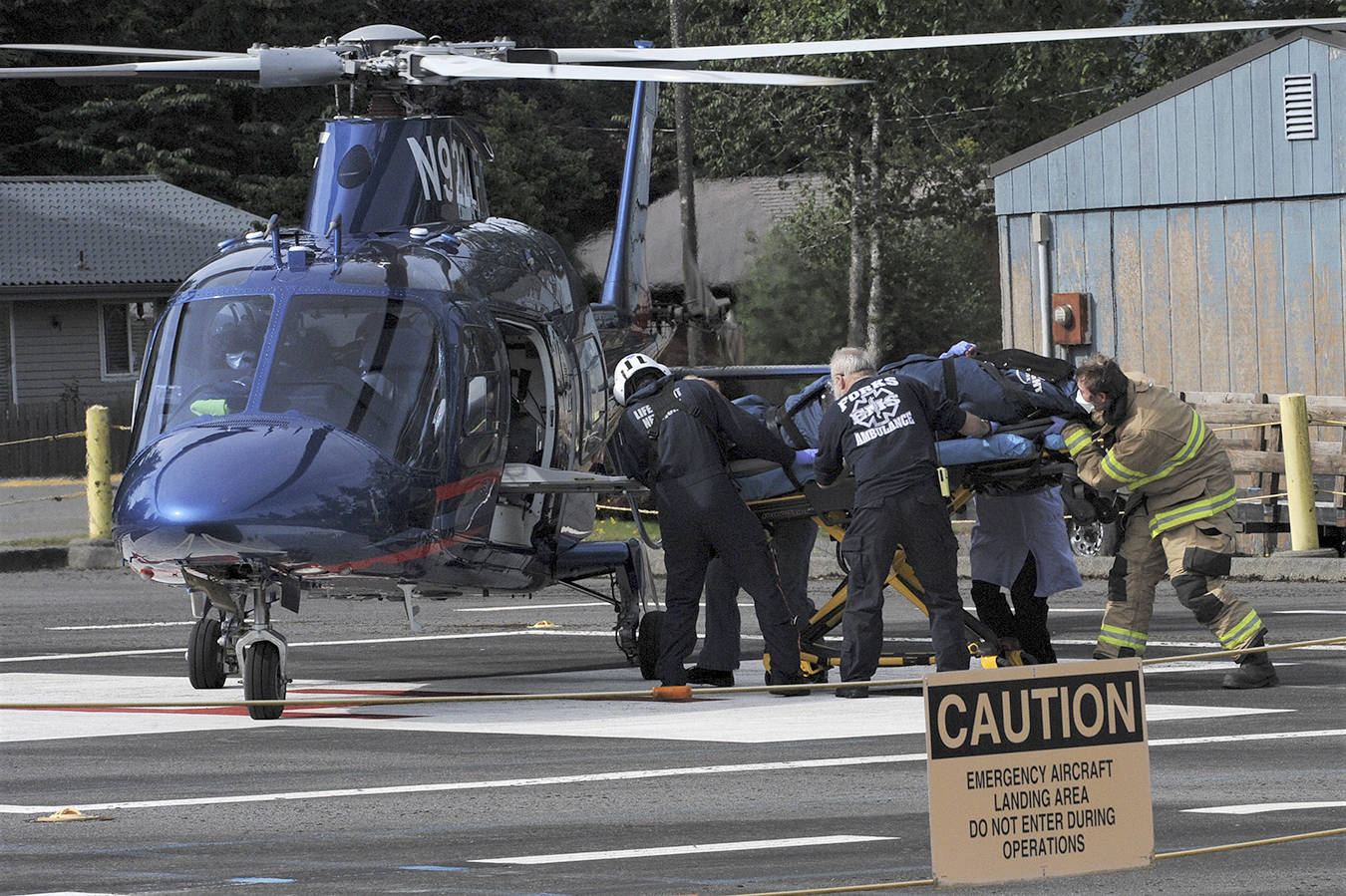 A 19-year-old female was airlifted by a Life Flight Network helicopter at 10:15 a.m. Sunday morning from the Forks Hospital after a vehicle rolled over near Riverside and West Snider roads on Highway 101. Seven other occupants were in the vehicle. Photo by Lonnie Archibald