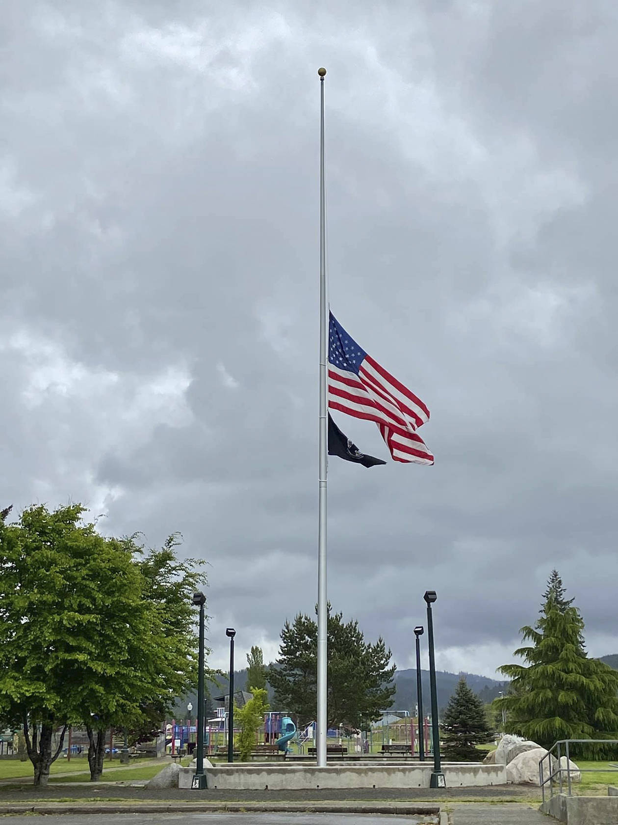 The Tillicum Park Flag Pole project was spearheaded by the Forks Lions Club with participation from the City of Forks and the Lloyd J. Allen Charitable Trust Fund, which made a substantial donation to the project. The Flag Pole Dedication Ceremony took place on April 27, 2019. This photo of the flag was taken on May 22, 2020, by Berlinda James.