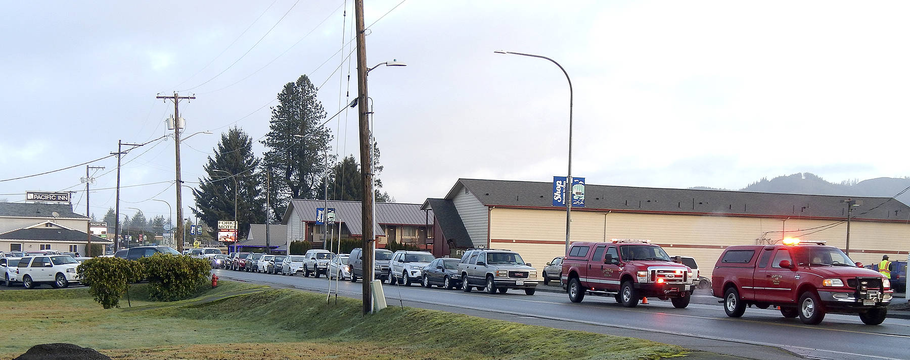 Traffic control volunteers used every available parking area on Friday, during the COVID-19 Vaccination Clinic, including down the turn lane on Forks Avenue. At Saturday’s clinic, line-ups were less visible as there was less of a rush at the beginning and the Transit Center parking area had more room available. Photo Christi Baron
