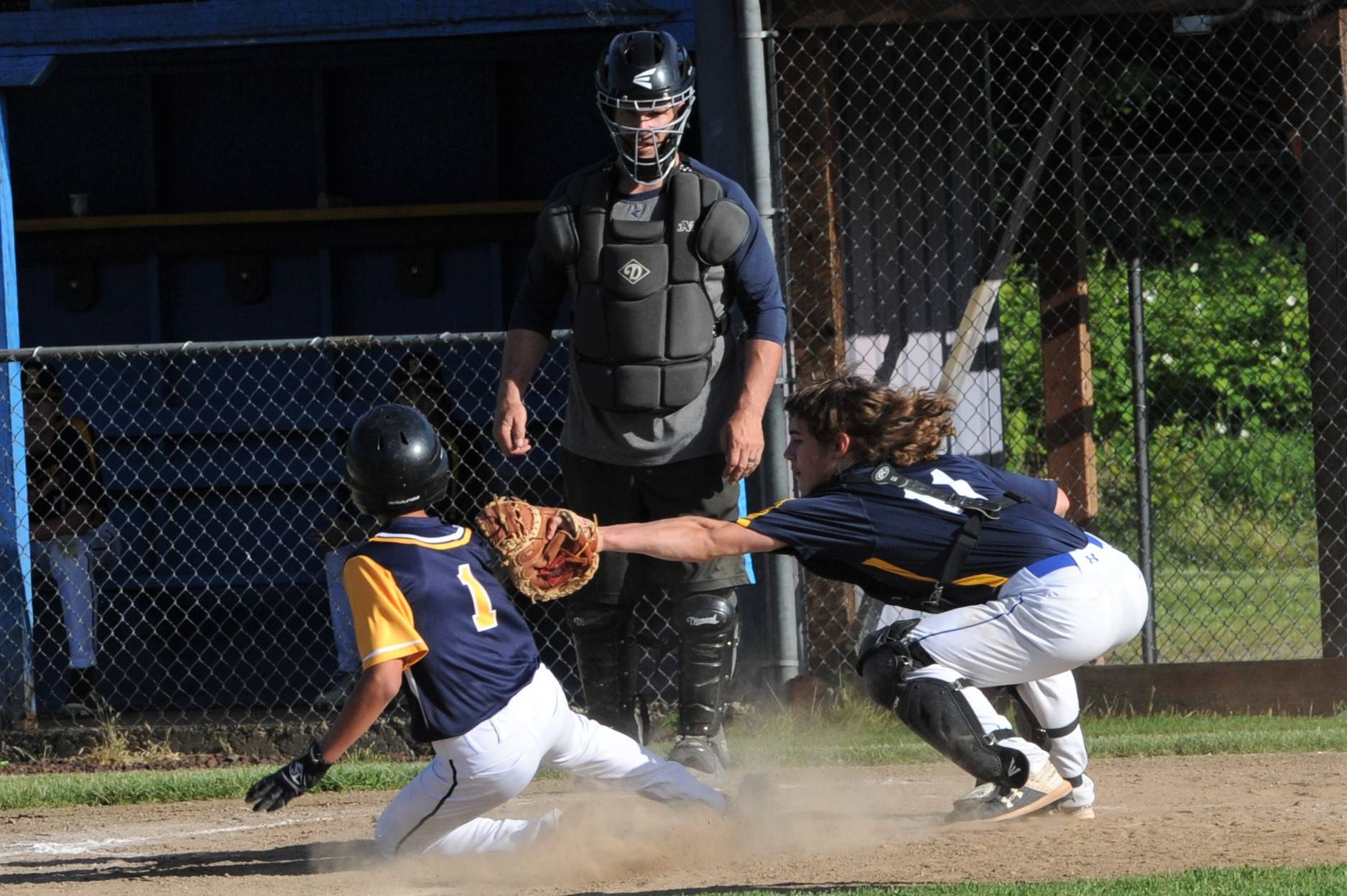 Forks’ runner Noah Foster (1) was tagged out at home by Beaver catcher Walker Wheeler. Umpiring is Carl Windle. Photo by Lonnie Archibald
