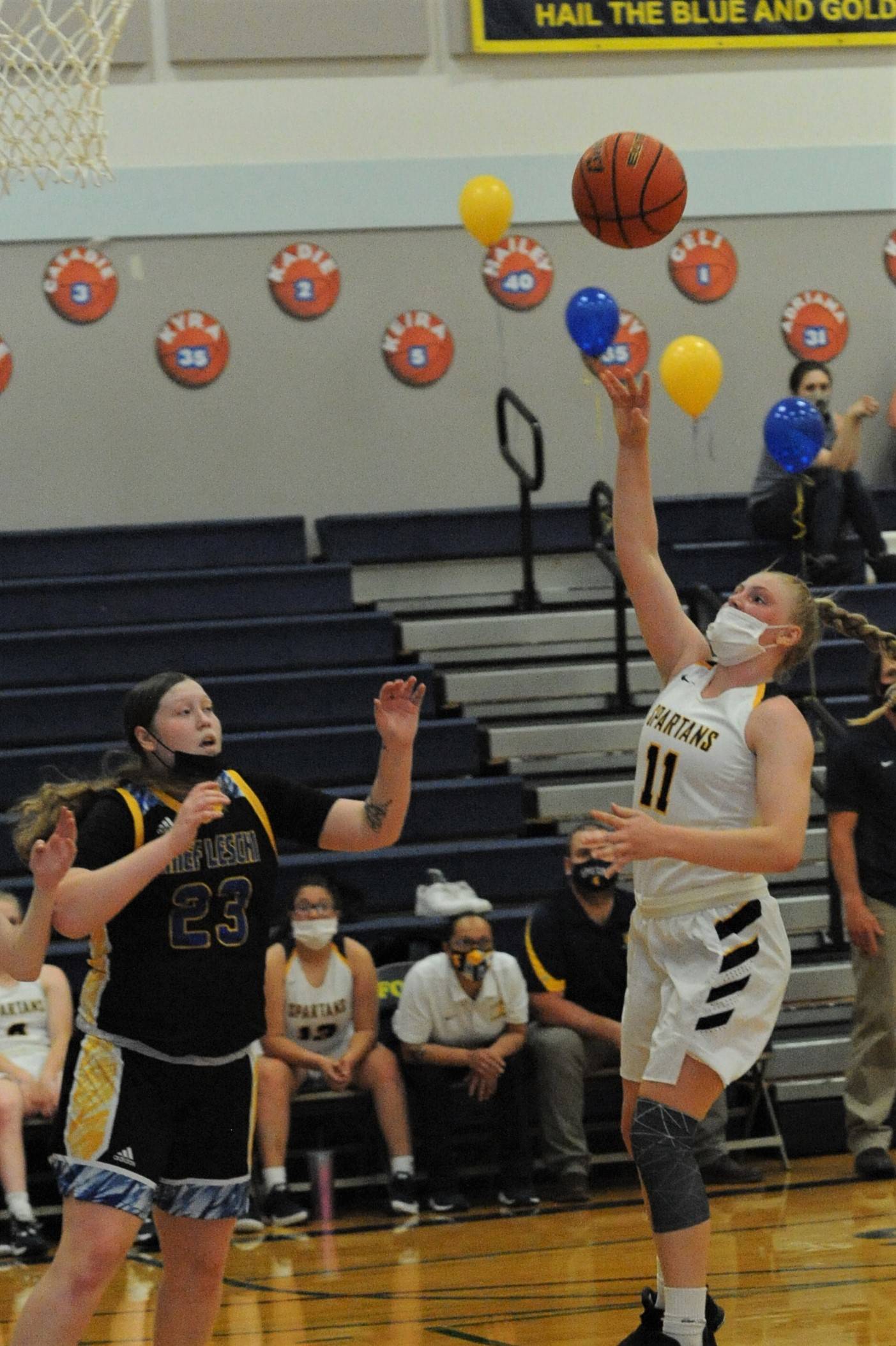 Kesia Rowley (11) puts up a shot in the key.