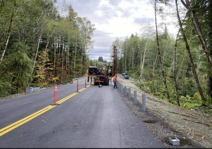 Driving the posts for the guardrail at the approaches to the Canyon Creek bridge, MP 10. Photos FHWA