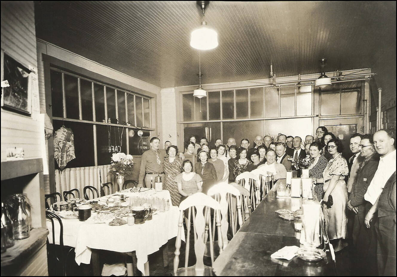 Ted and Rose Heyder once managed the hotel, restaurant, and bar. Here staff and maybe guests gathered for a photo in the restaurant on the bottom floor sometime in the 1930s.