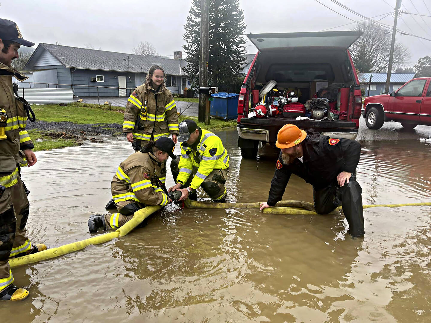 “I’ve seen fire and I’ve seen rain”
Clallam County Fire Protection District #1 was called out on Sunday to deal with an abundance of water over the roadway near 2nd Avenue.
With the help of Engine 91’s crew and a large pumper off of Tanker 91, it took about 4 hours to clear the street and surrounding houses of most of the large mass of water that was left from recent rains. Photo CCFD1
