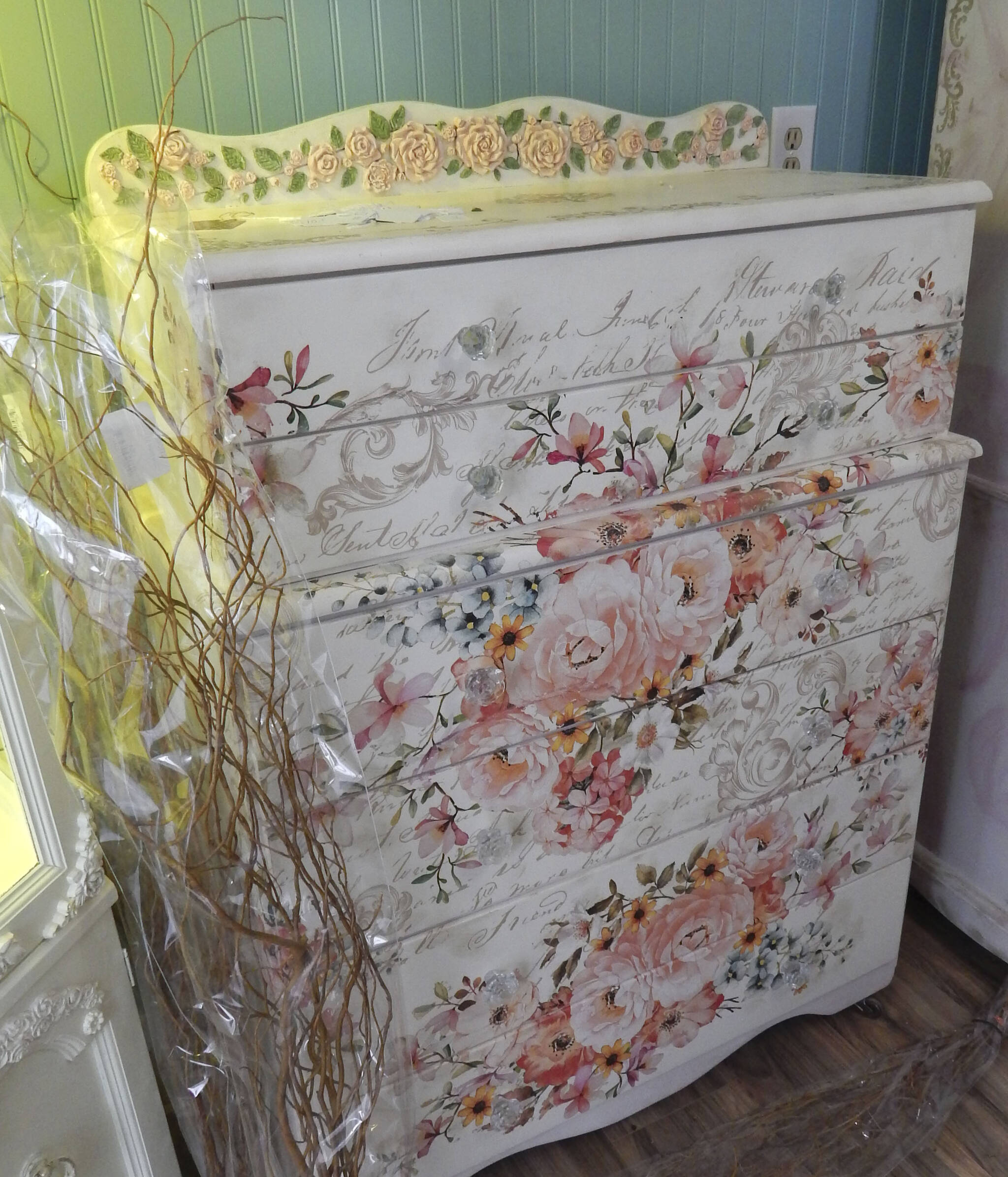 Offering new and repurposed painted furniture with a mixture of decoupage and other artistic details. Photo Christi Baron