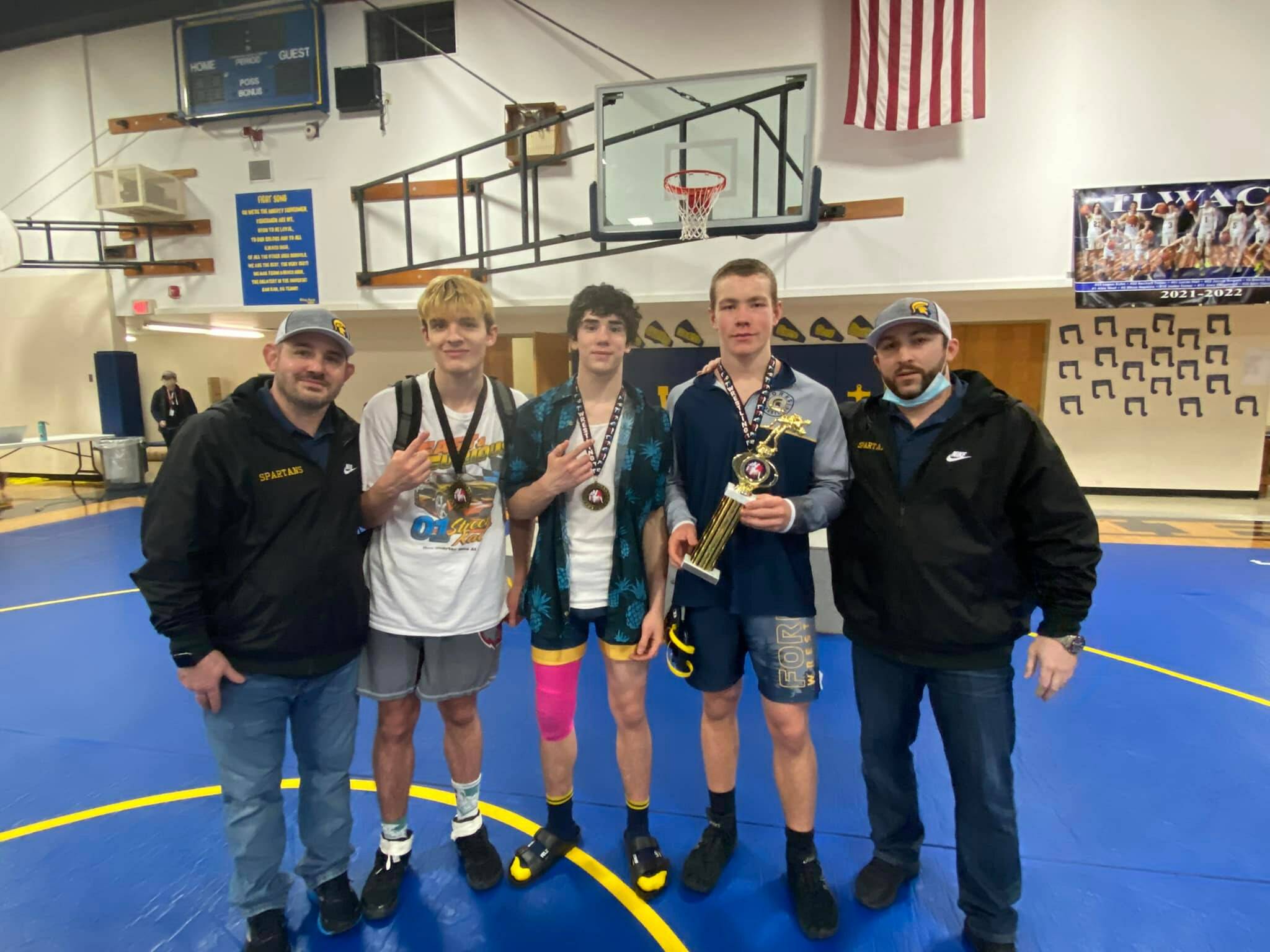 Individual Champs with coaches left to right: Coach Weakley, Jake Weakley 152 lbs, Walker Rondeau 132 lbs, Nate Dahlgren 170 lbs, and Coach Fishkorn.