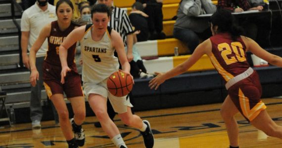 Spartan Keira Johnson drives against Winlock in an earlier game played in Forks in which the Spartans defeated the Cardinals in District 4 play. The Forks girls went on to defeat Ilwaco in Rochester 67 to 36. In that game, Johnson scored 27 points. Forks was to face Rainier in Castle Rock on Tuesday, Feb. 15 after the press deadline for the Forks Forum. Photo by Lonnie Archibald