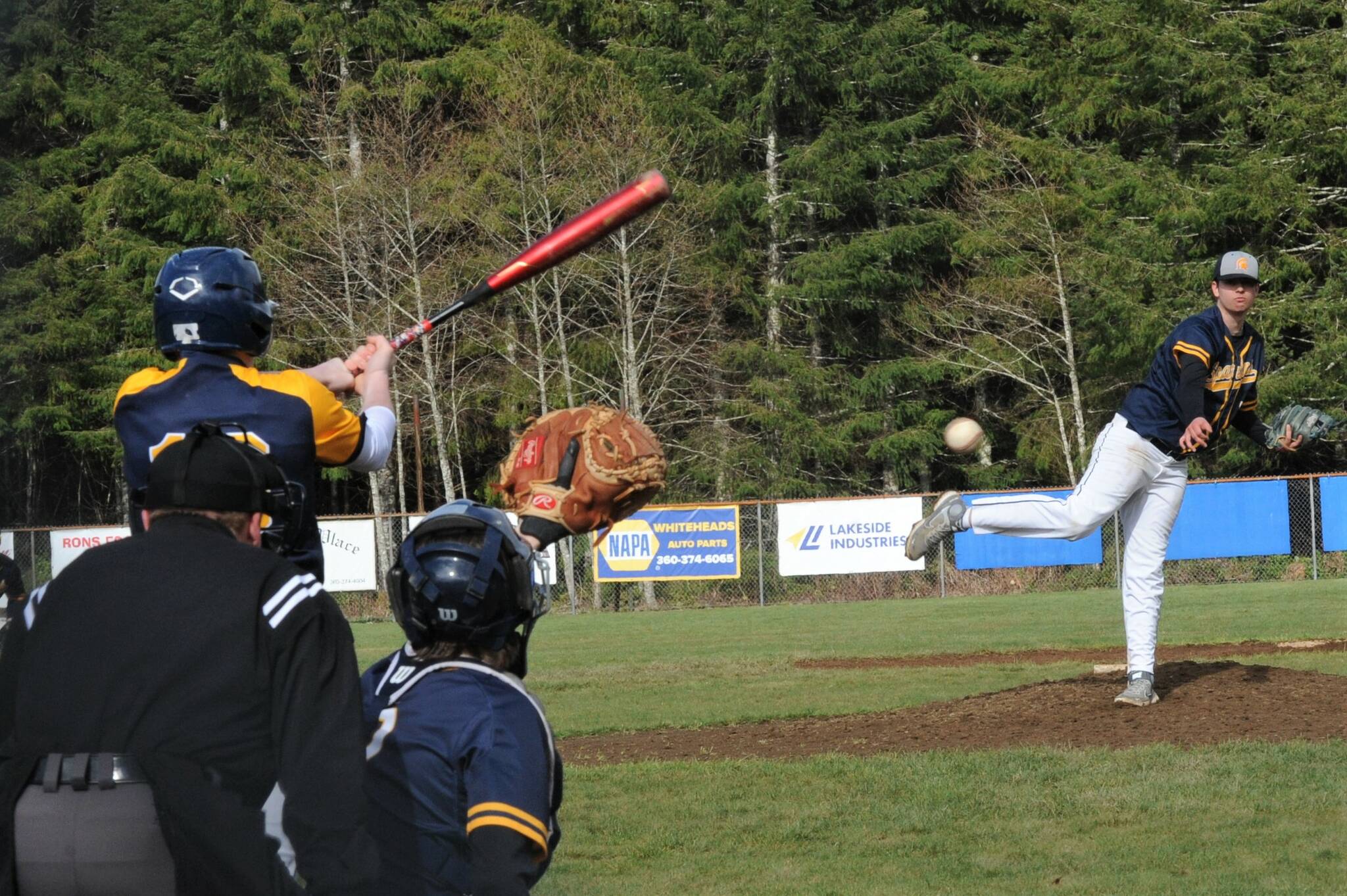 Spartan pitcher Logan Urvina delivered the pitch which was hit to second baseman Dalton Kilmer who in turn threw to Gunner Rogers at first for the out. Catching is Spartan Keaton Northcut. Forks took both games of the doubleheader with 19 to 3 and 13 to 11 wins. Photo by Lonnie Archibald (Final scores were uncertain at press time)