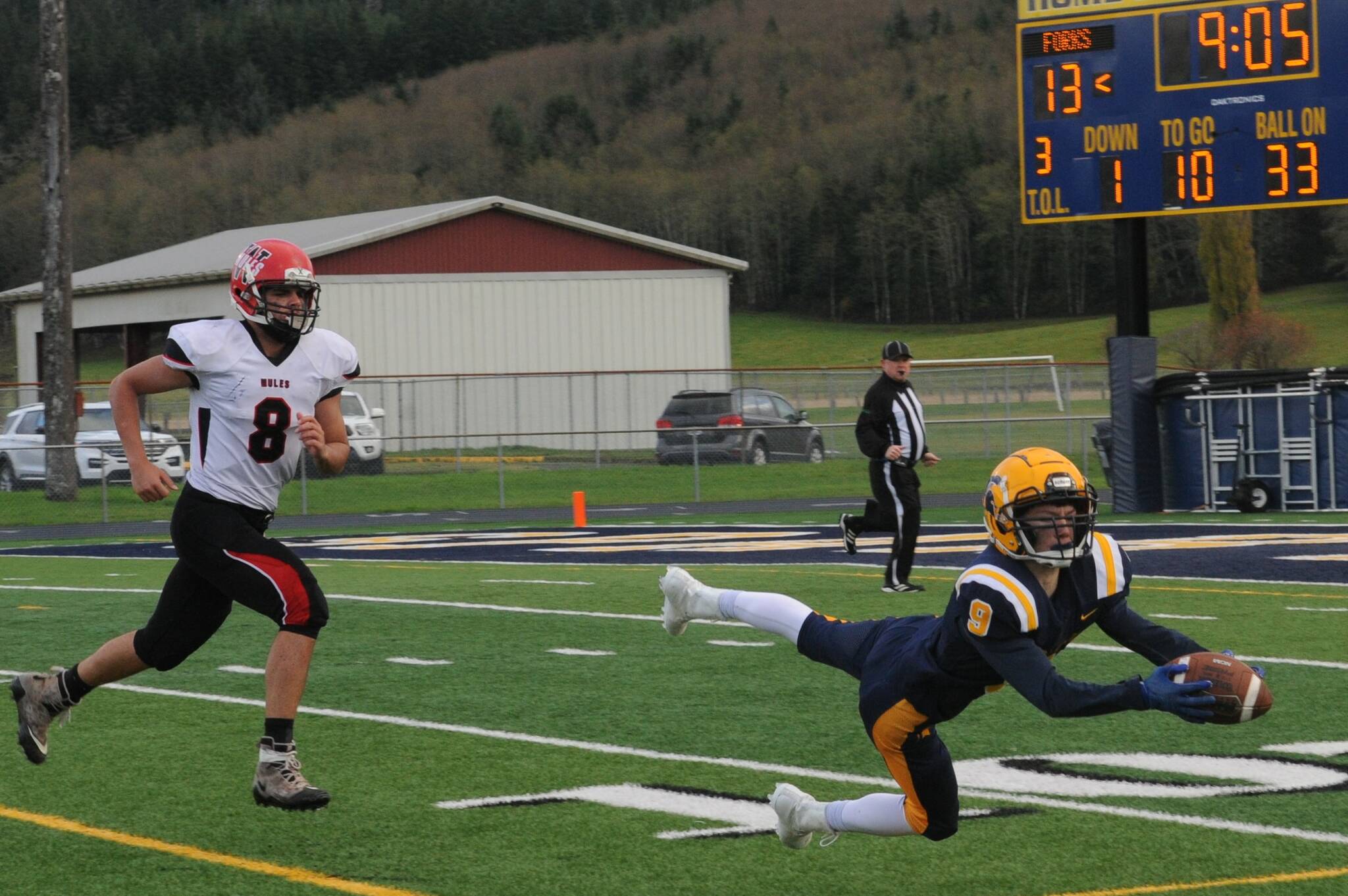 Spartan Dalton Kilmer will share his football talents with the Westside team in Yakima in June. Here Dalton dives and makes this catch against Wakiakum at Spartan Stadium. Photo by Lonnie Archibald
