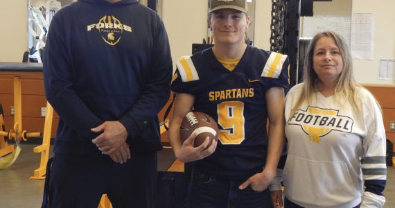 Spartan football coach Trevor Highfield, Dalton Kilmer, and his mom Alissa Kilmer. Photo Christi Baron