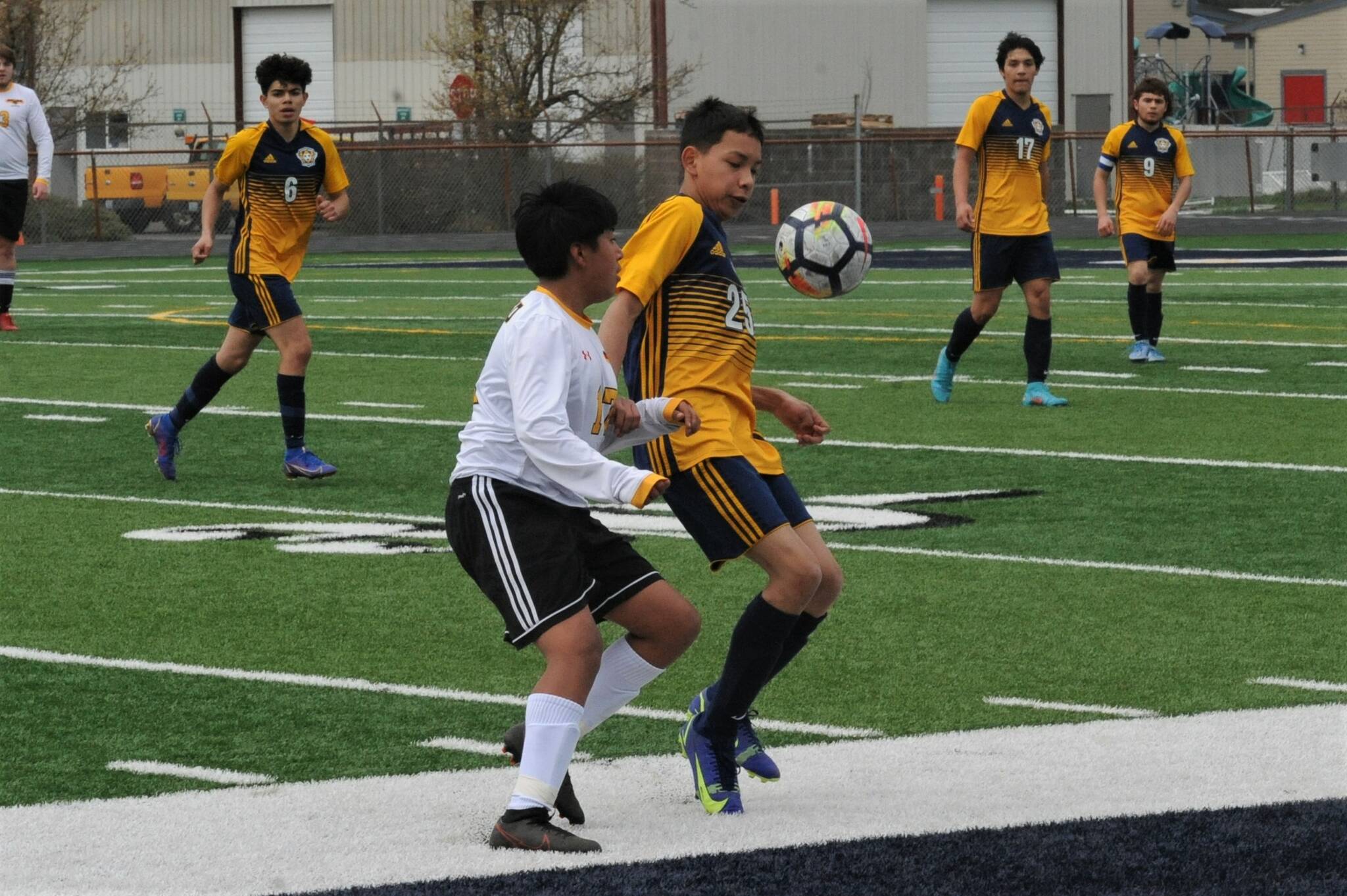 Jorge Diaz-Rodriguez challenges Winlock for ball control. Looking on are Spartans from left, Arturo Gomez, Pedro Ayala and Juan Contreras.